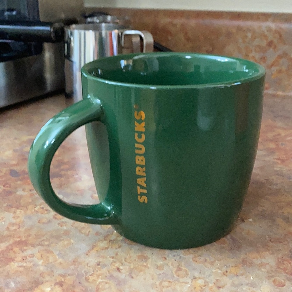 Green Starbucks mug with gold logo